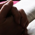 praying w bible_red
