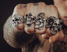 https://www.pexels.com/photo/man-wearing-silver-skull-ring-194087/